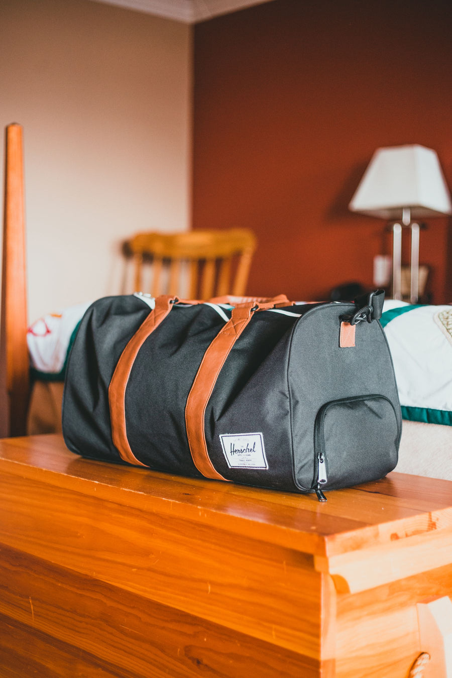 Gym & Travel Duffel — Structured duffel with a shoe compartment and padded shoulder strap.