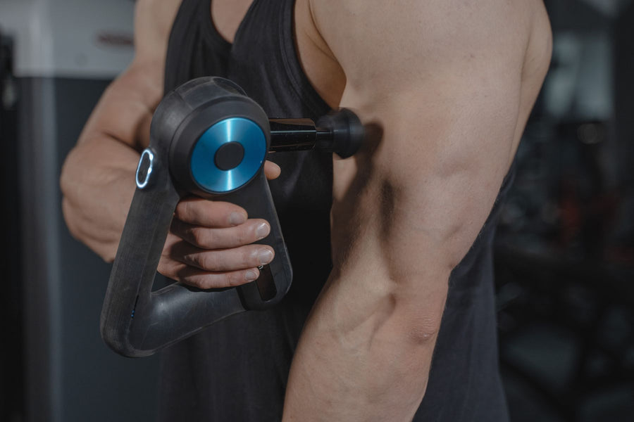 Pro Percussion Massage Gun — Quiet, cordless percussion massager with interchangeable heads for targeted muscle relief.